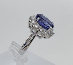 Silver ring with blue gemstone and diamonds.