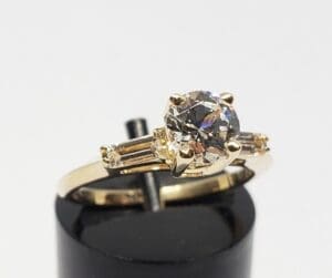 Gold ring with large central diamond.
