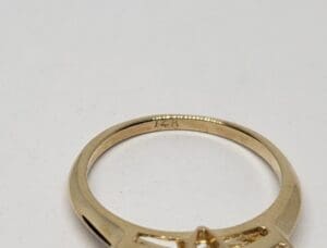 Gold ring with engraved details.