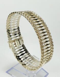Gold bracelet with intricate chain design.