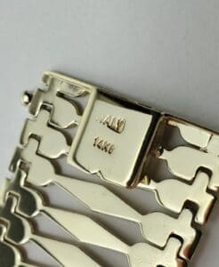 Gold bracelet clasp with "14K Italy" stamped.