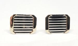 Gold and black striped rectangular cufflinks.