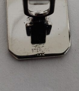 Silver pendant engraved with "14K Sterling.