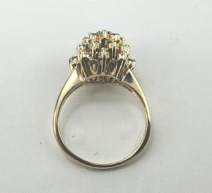 Gold ring with intricate gemstone setting.