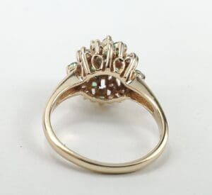 Gold ring with intricate gemstone setting.