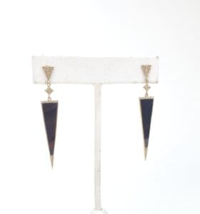 Gold and black triangular drop earrings.