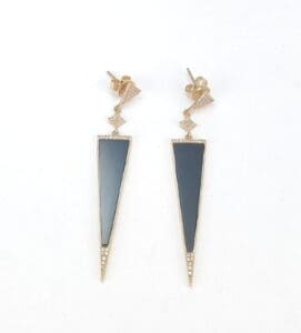 Gold and black geometric drop earrings.