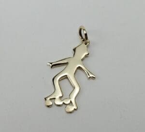 Skating figure pendant with roller skates.