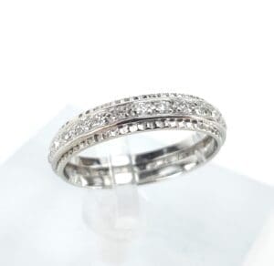 Silver ring with intricate diamond detailing.