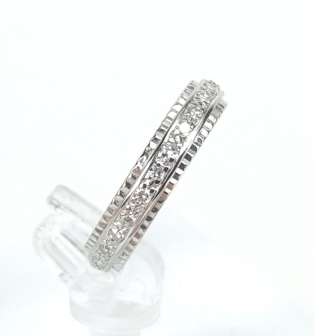 Silver ring with embedded clear stones.