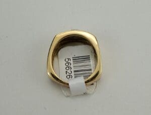 Gold ring with a barcode tag.