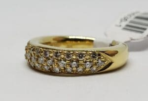 Gold ring with multiple small diamonds.
