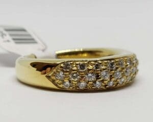 Gold ring with embedded small diamonds.