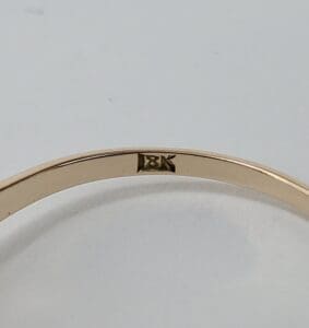 18K gold ring with hallmark stamp.