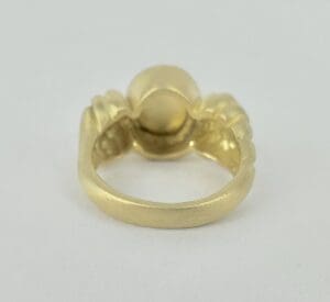 Gold ring with a unique design.