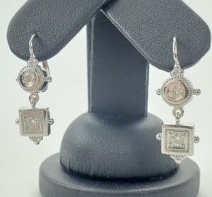 Silver earrings with square and round stones.