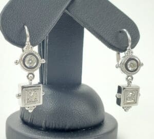 Silver earrings with square and round stones.