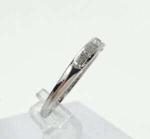 Silver ring with small rectangular stones.