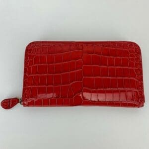 Red crocodile-patterned leather wallet.
