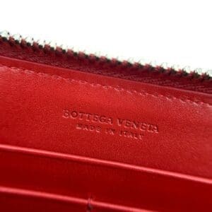 Red Bottega Veneta wallet, made in Italy.