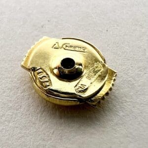 Gold metal object with engraved details.