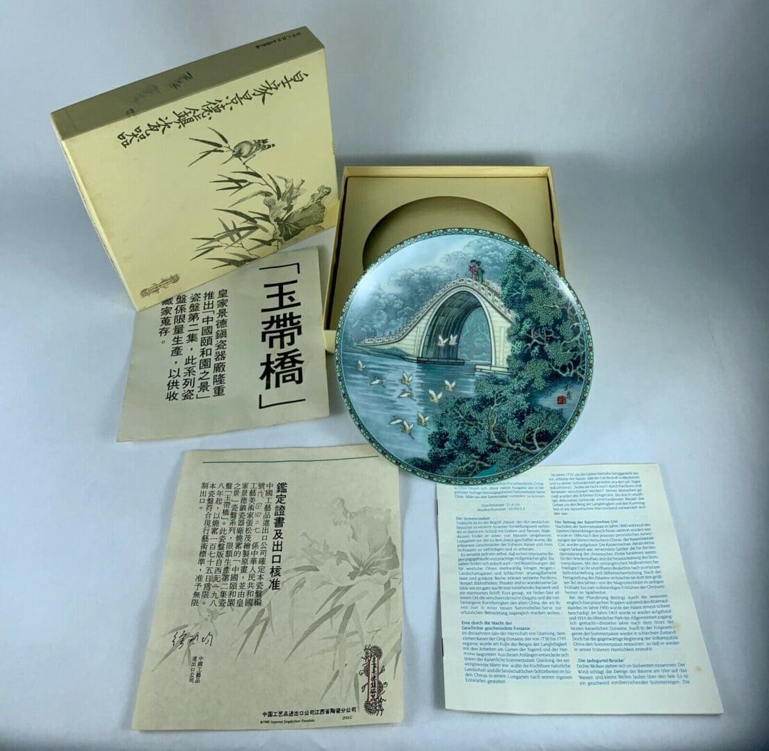 Decorative plate with box and documents.