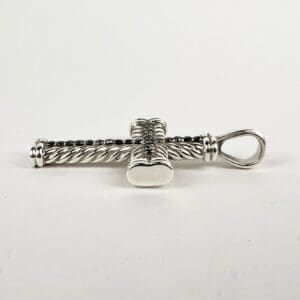 Silver twisted cross pendant with loop.