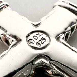 Sterling silver jewelry with maker's mark.