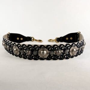 Decorative belt with ornate metal embellishments.