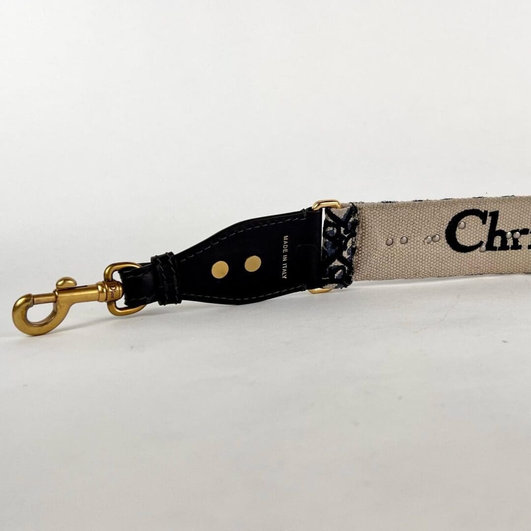 Designer bag strap with metal clip.