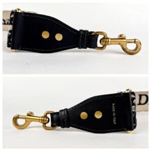 Black leather strap with gold clasp.