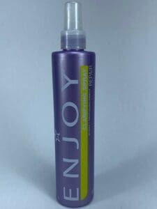 Purple bottle of Enjoy clarifying spray.