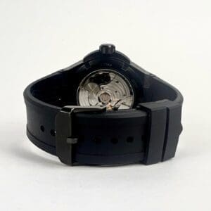 Black watch with visible mechanical movement.