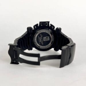 Black watch with open metal clasp.