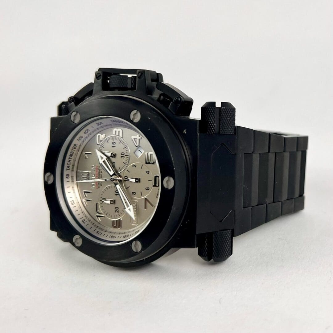 Black watch with silver chronograph dial.