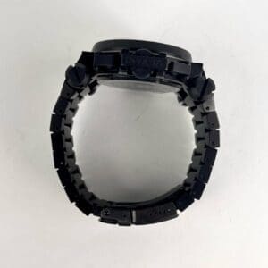 Black wristwatch with linked metal band.