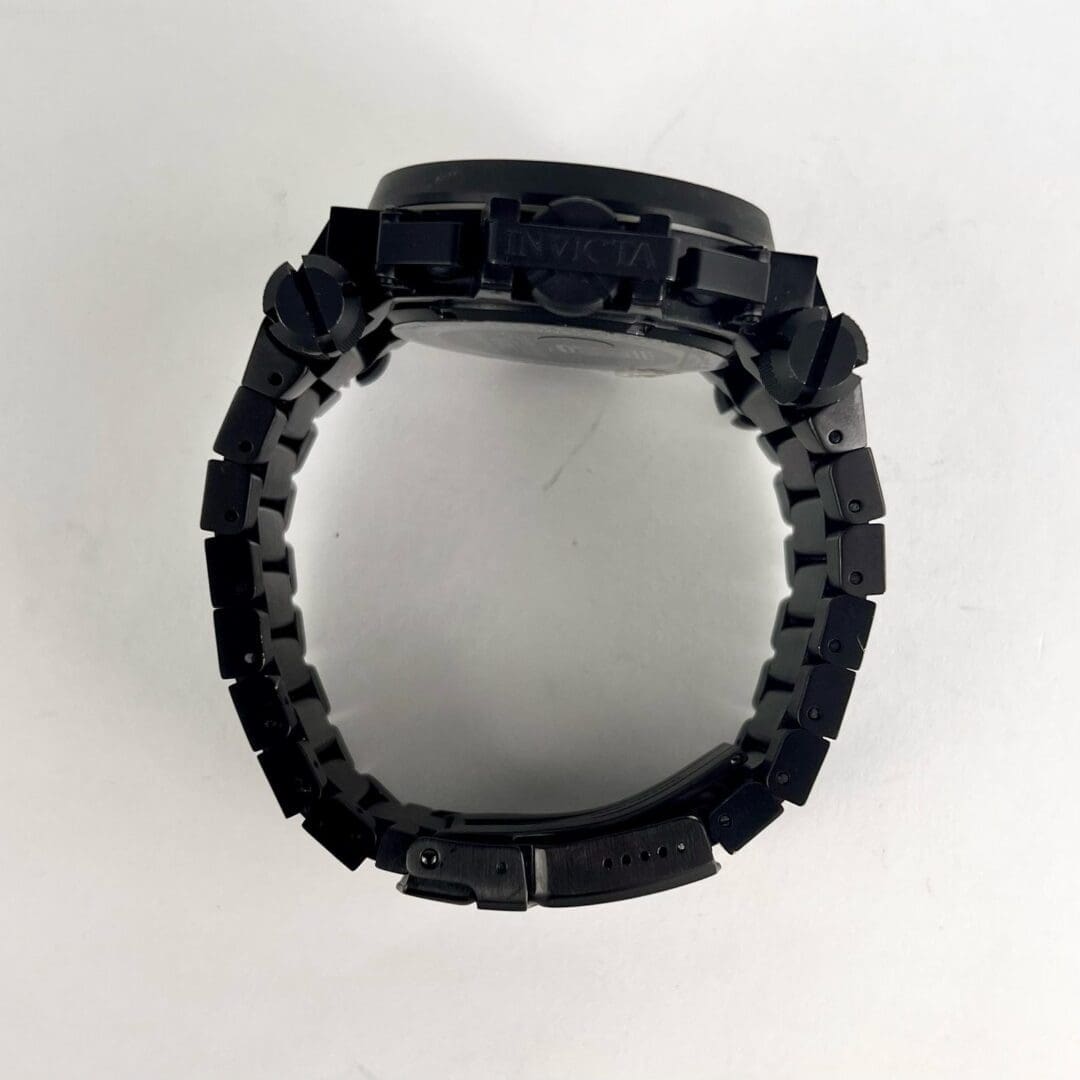 Black wristwatch with linked metal band.