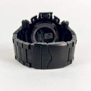 Black metal watch with closed clasp.