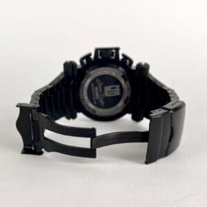 Black watch with open metal clasp.