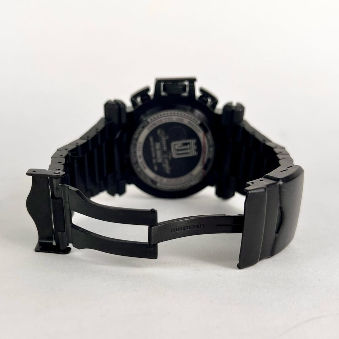 Black watch with open metal clasp.