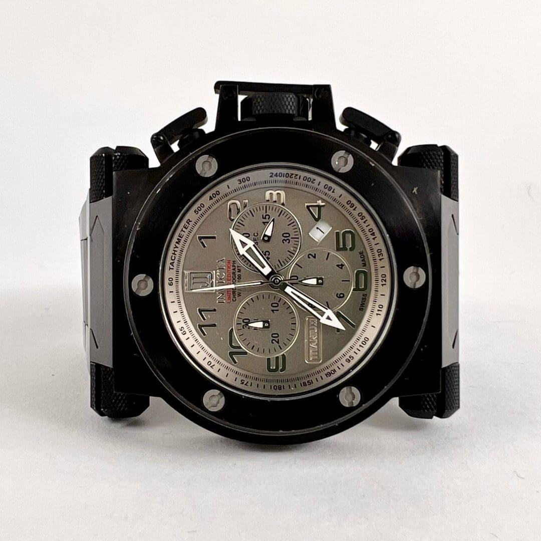 Black and silver wristwatch with multiple dials.