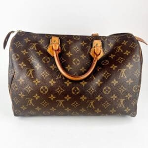 Brown designer handbag with monogram pattern.