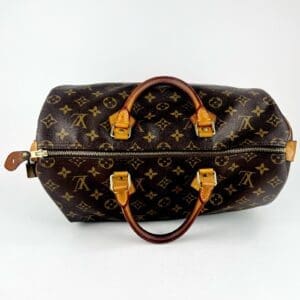 Brown monogram leather handbag with handles.