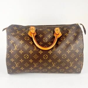 Brown designer handbag with monogram pattern.