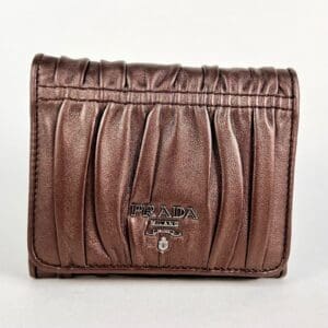 Brown leather wallet with Prada logo.