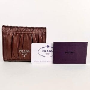 Brown Prada wallet with authenticity cards.