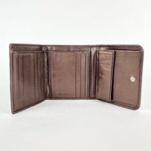 Open brown leather wallet on display.