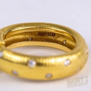 Gold ring with diamond accents, "Morelli" engraved.