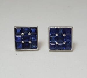 Square blue gemstone stud earrings.
