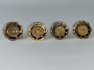 Four Plymouth Cordage Co. gold buttons.